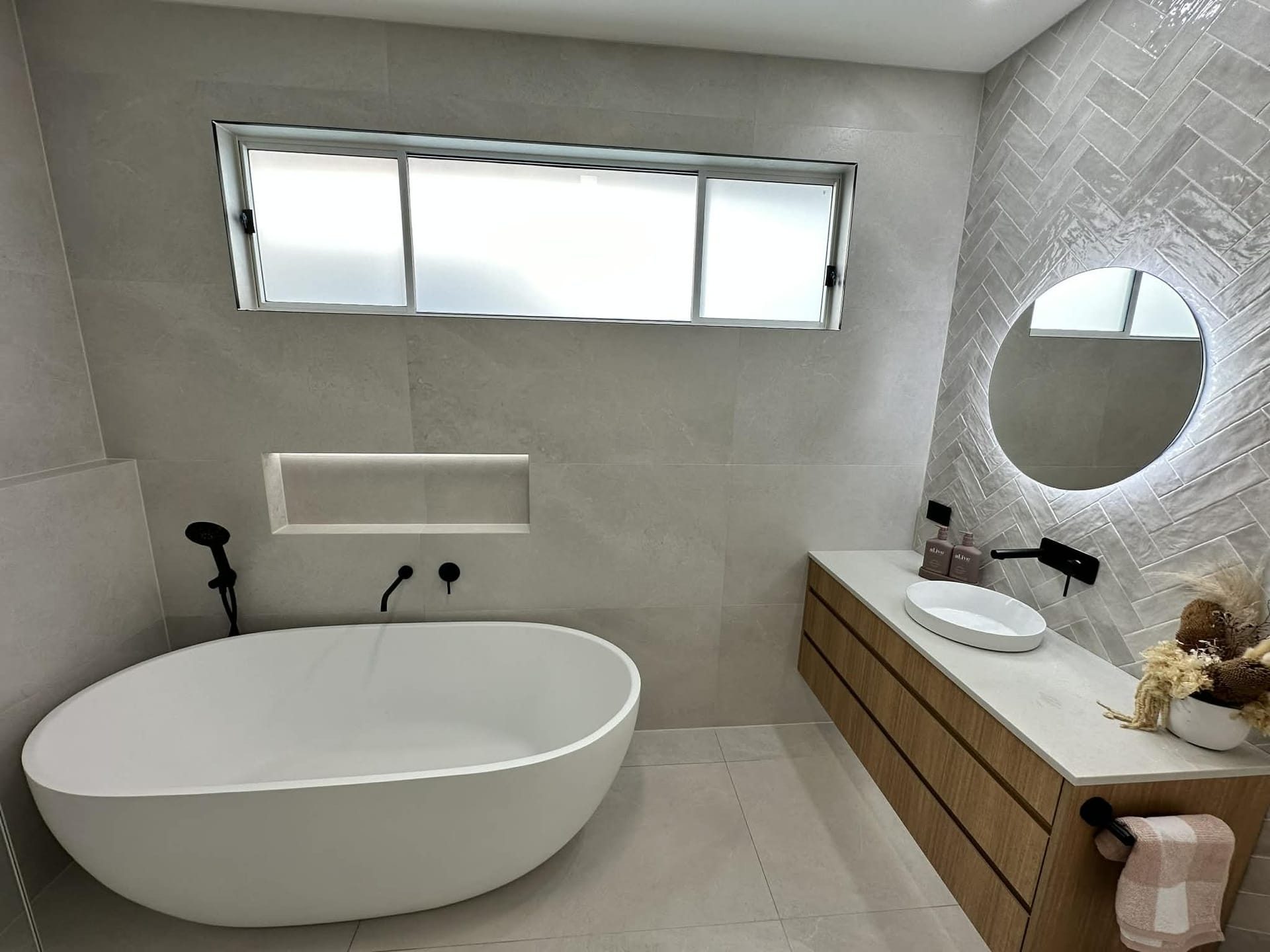 Bathroom renovation with freestanding bath and timber vanity by ASP Build & Co, Adelaide